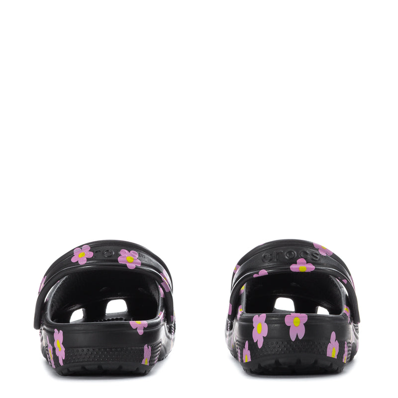 Kids' black clog with pink flower print, back view showing heel and strap