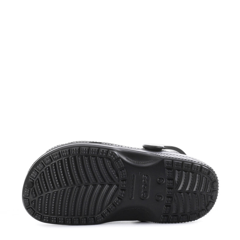 Kids' black clog outsole with grippy tread pattern, molded texture
