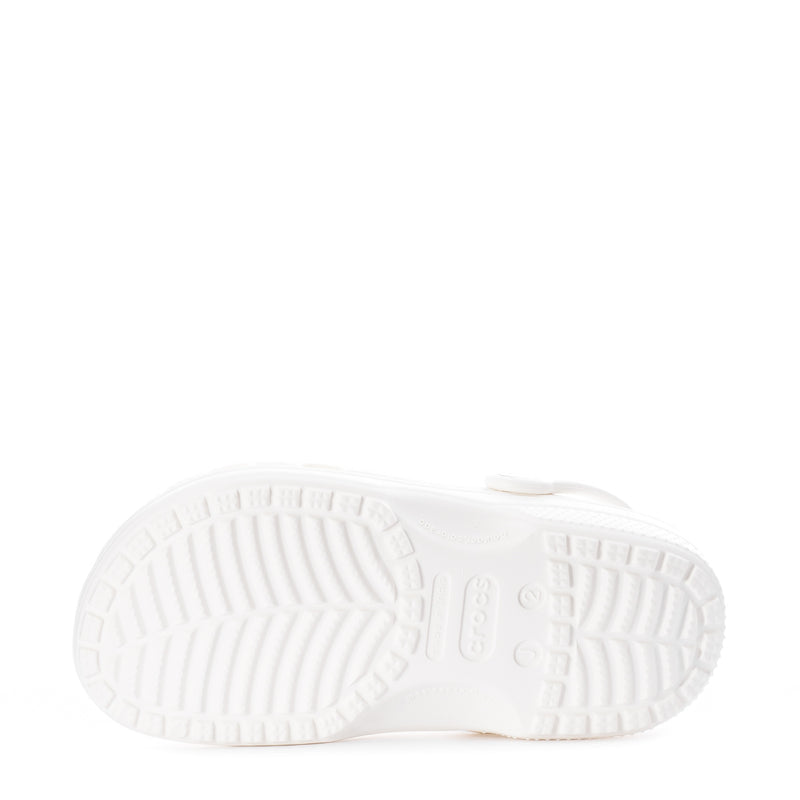Kids' white clog outsole with deep tread grooves and logo molded in