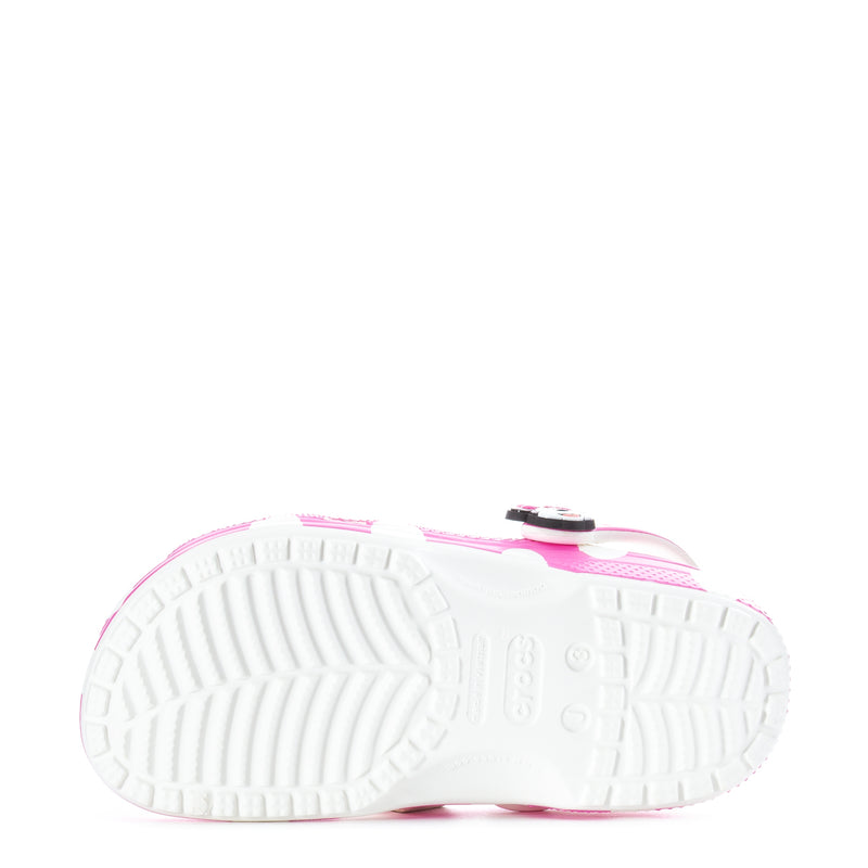 Kids' pink clog outsole underside with white tread and circular grip details