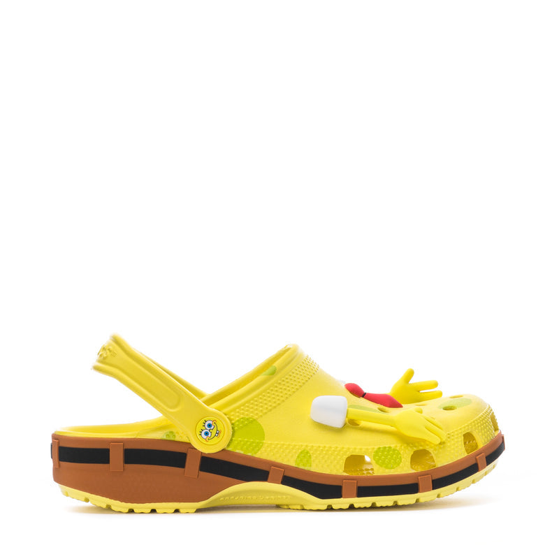 Men's yellow clog with molded cartoon graphic, white and red accents, black tread sole
