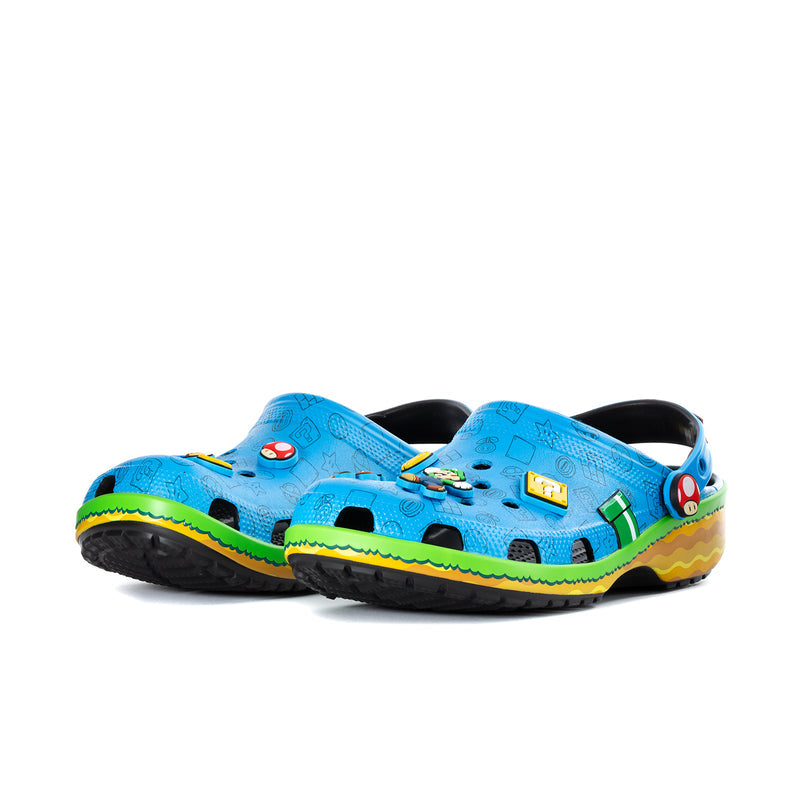 Men's blue classic clog, side view, molded holes and colorful Super Mario charms