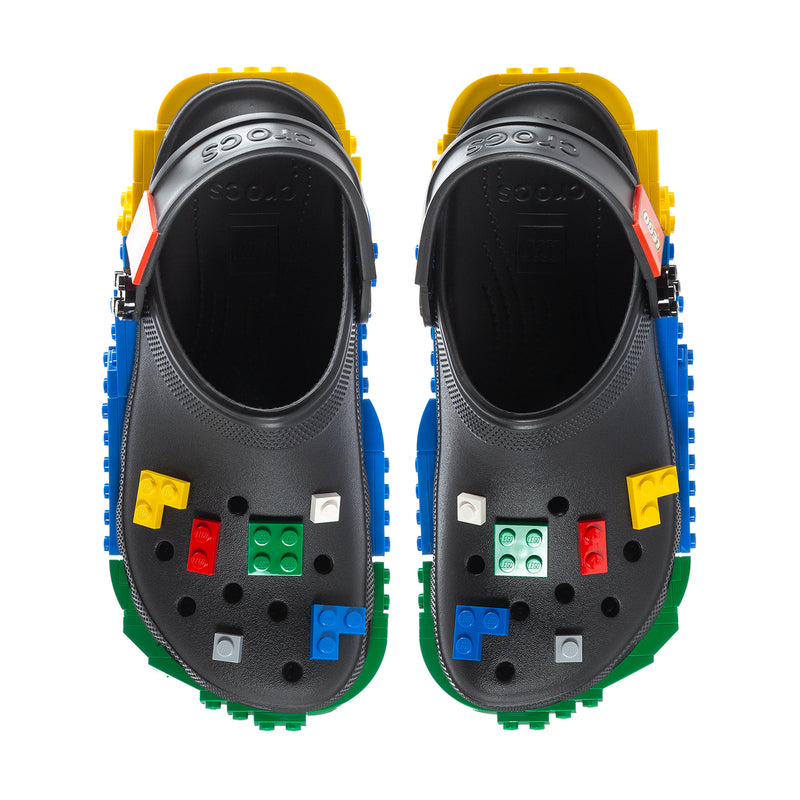 Pair of men's black clogs with multicolor LEGO block details on heel and toe