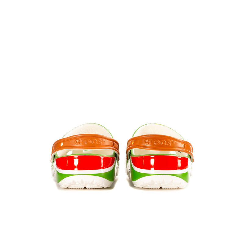 Green clogs from heel view with orange back strap and red band