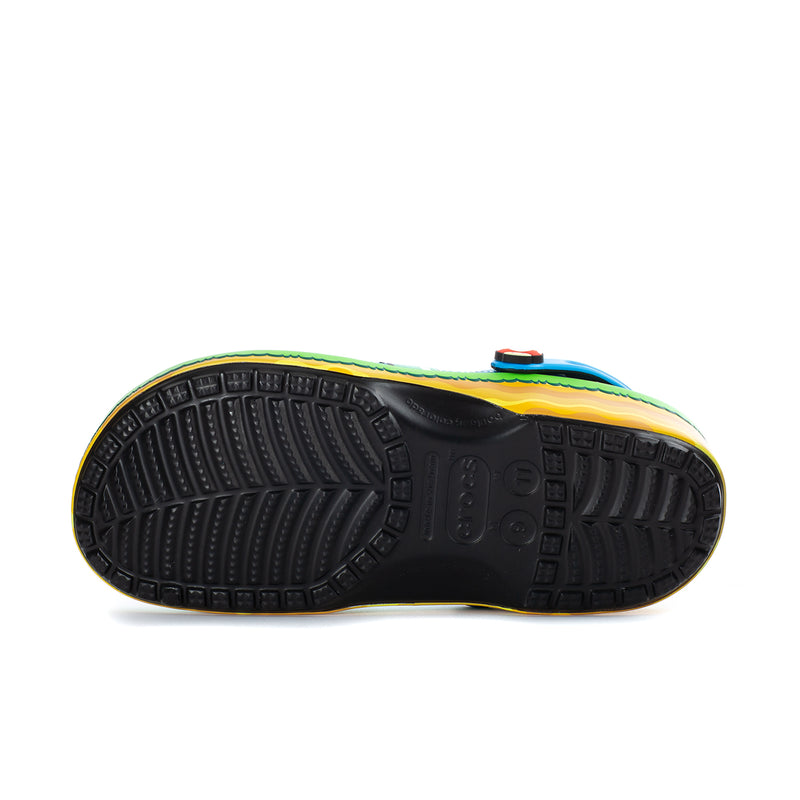 Men's blue classic clog outsole tread viewed from bottom, with contrast yellow edge