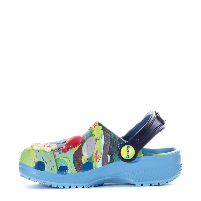 Toddler clog in green-and-multicolor Bluey print with navy heel strap.