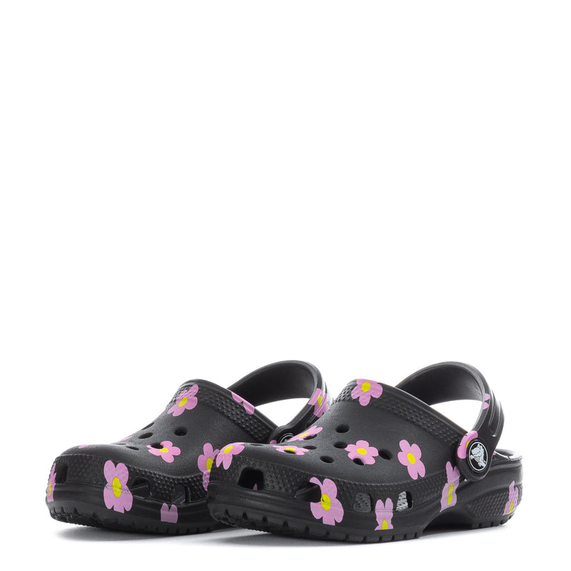 Toddler clog in black with pink flower print, rear side view with logo badge