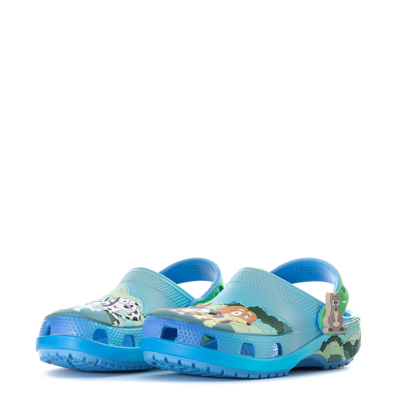 Toddler blue clog pair with animal print and green accents, side profile.