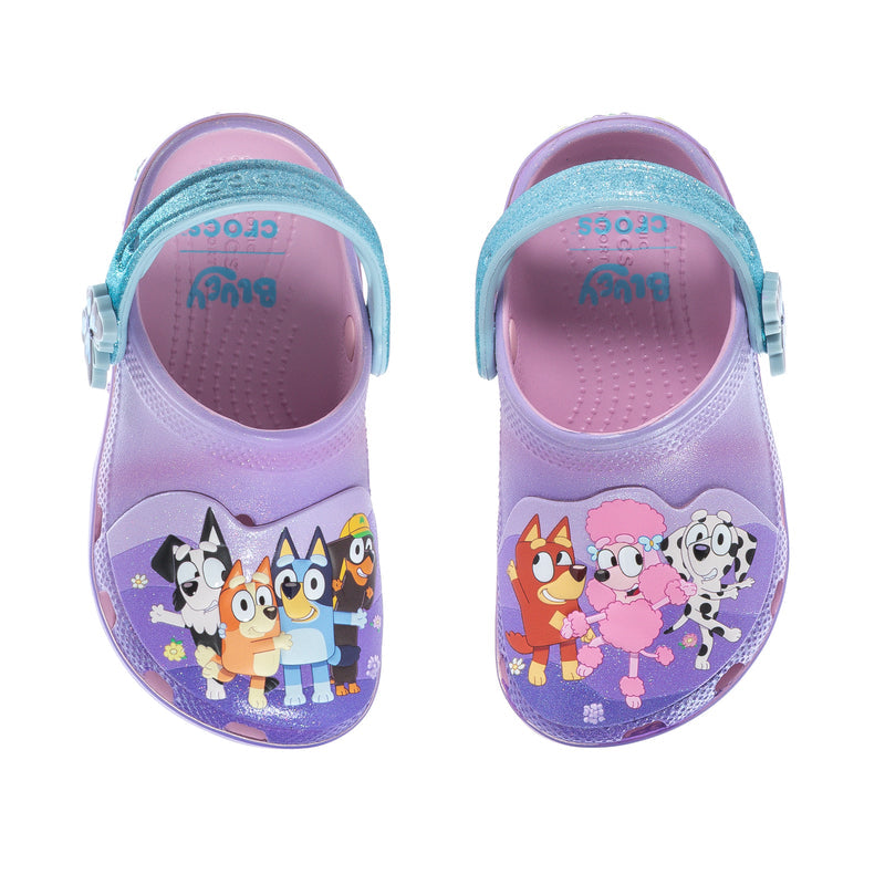 Purple toddler clogs with teal straps and character print on instep, top view