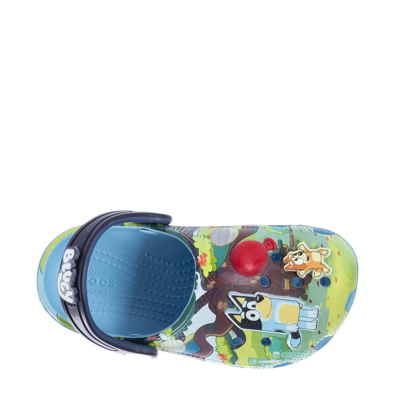 Toddler clog side view with Bluey pattern and navy adjustable heel strap.