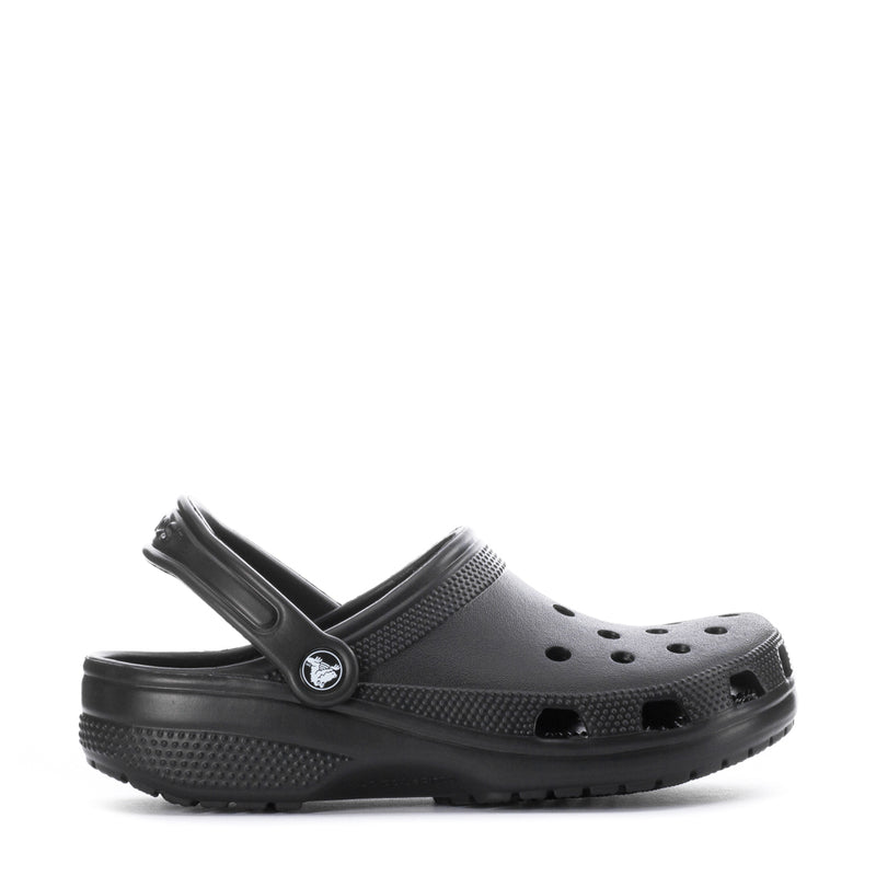 Youth black clogs with perforated upper, adjustable heel strap and circular logo buckle.