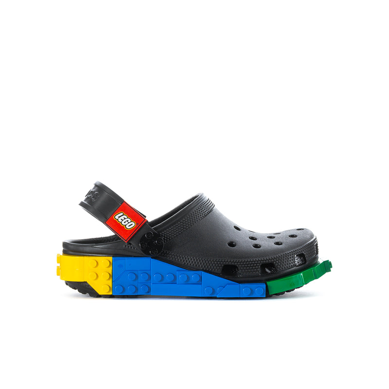 Youth clog with black perforated upper and red LEGO label on adjustable strap