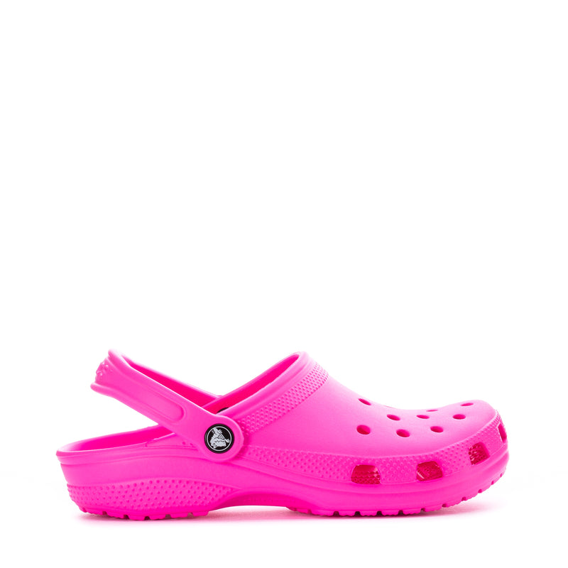 Youth Crocs classic clog in bright pink with perforated upper and strap
