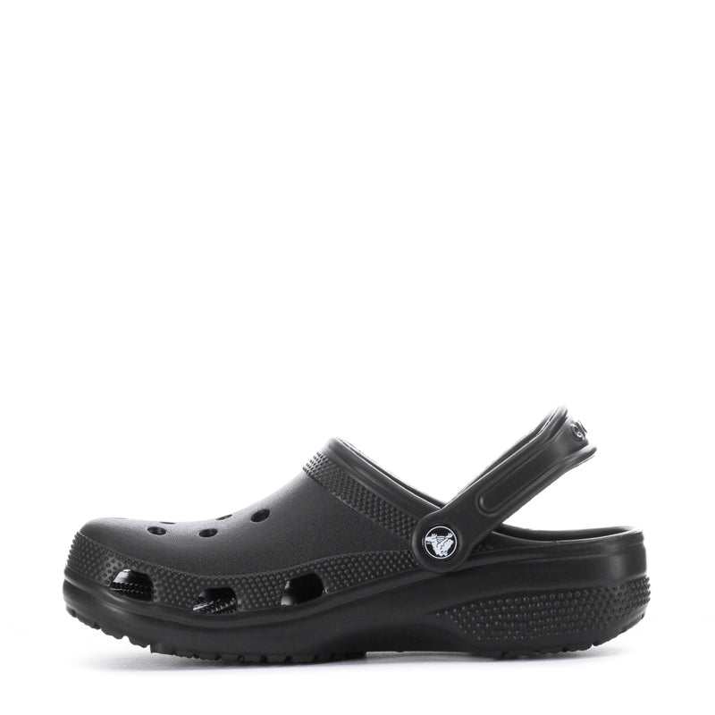 Youth black clog, side view with ventilation holes and cushioned textured outsole.