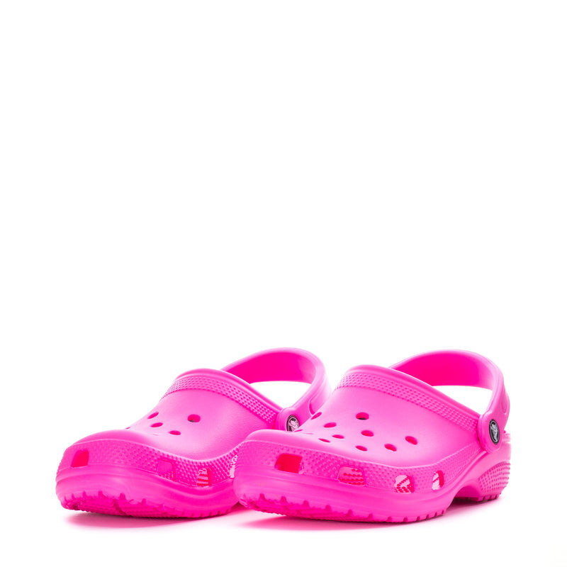 Youth Crocs classic clogs in bright pink with vent holes and heel strap