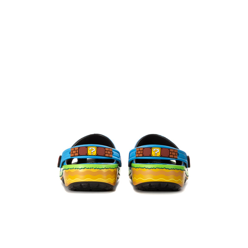Pair of youth blue clogs with green/yellow heel bands and black back straps.