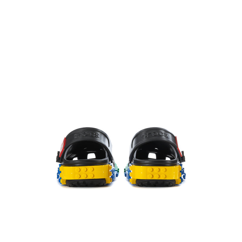 Youth clogs with black back straps and colorful yellow, blue, and green heel base