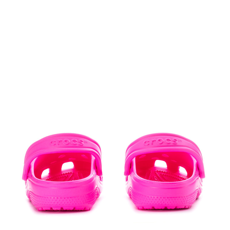 Youth Crocs classic clogs in bright pink, back view with heel openings