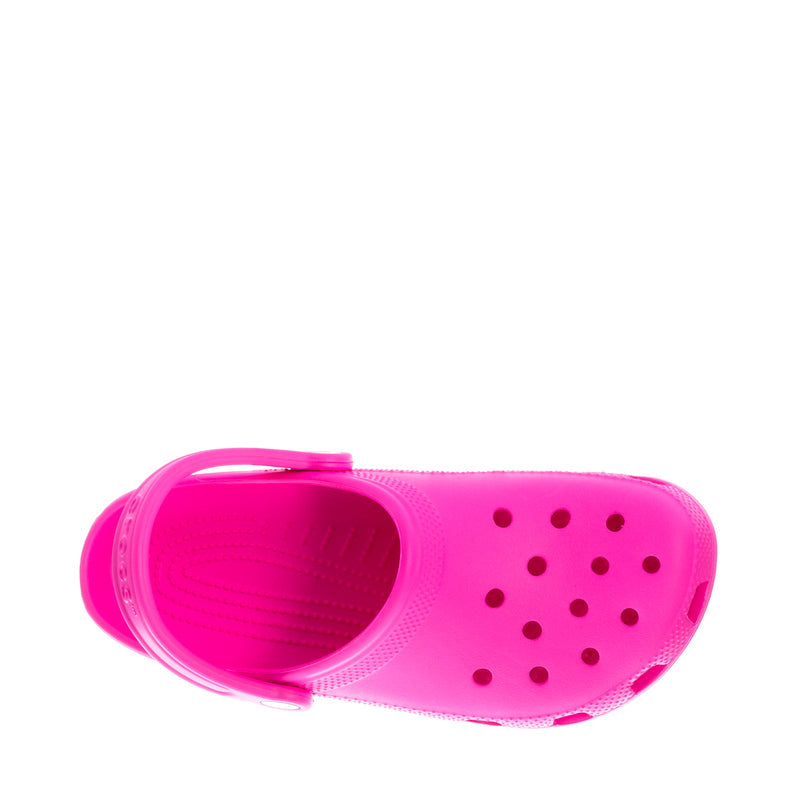 Youth Crocs classic clog in bright pink, slip-on with vent holes