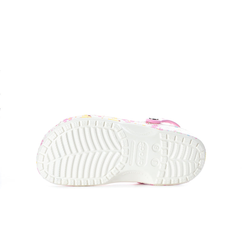 Youth classic clog outsole view with ridged white tread and pink-lined heel