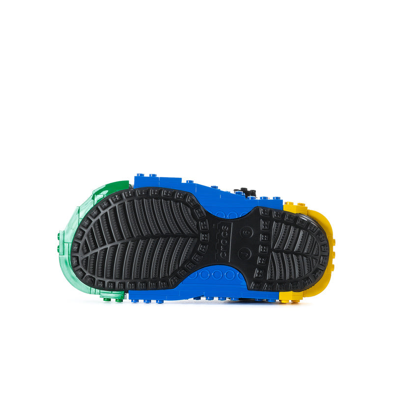 Youth clog outsole view with textured tread in green, blue, and yellow accents