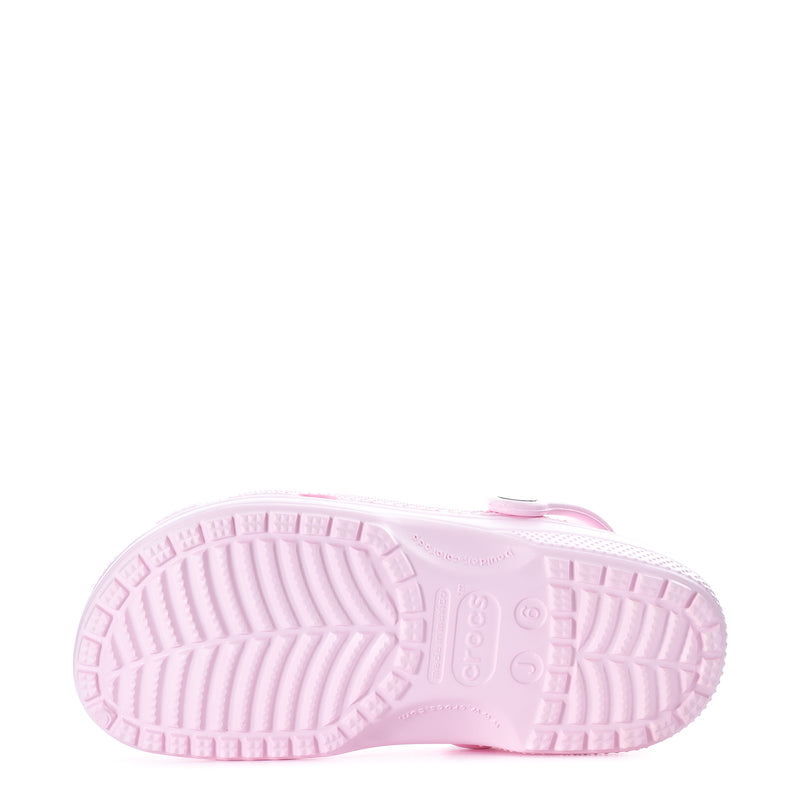 Light pink youth clog outsole with textured tread pattern