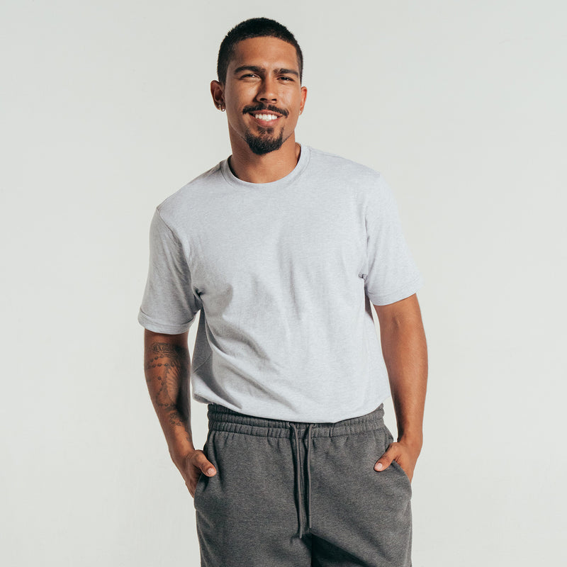 Men's heather gray crew-neck T-shirt, short sleeves, worn with dark joggers
