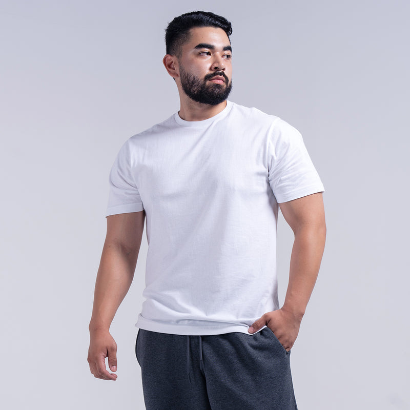 Men's white crew neck short-sleeve T-shirt on model, side front view