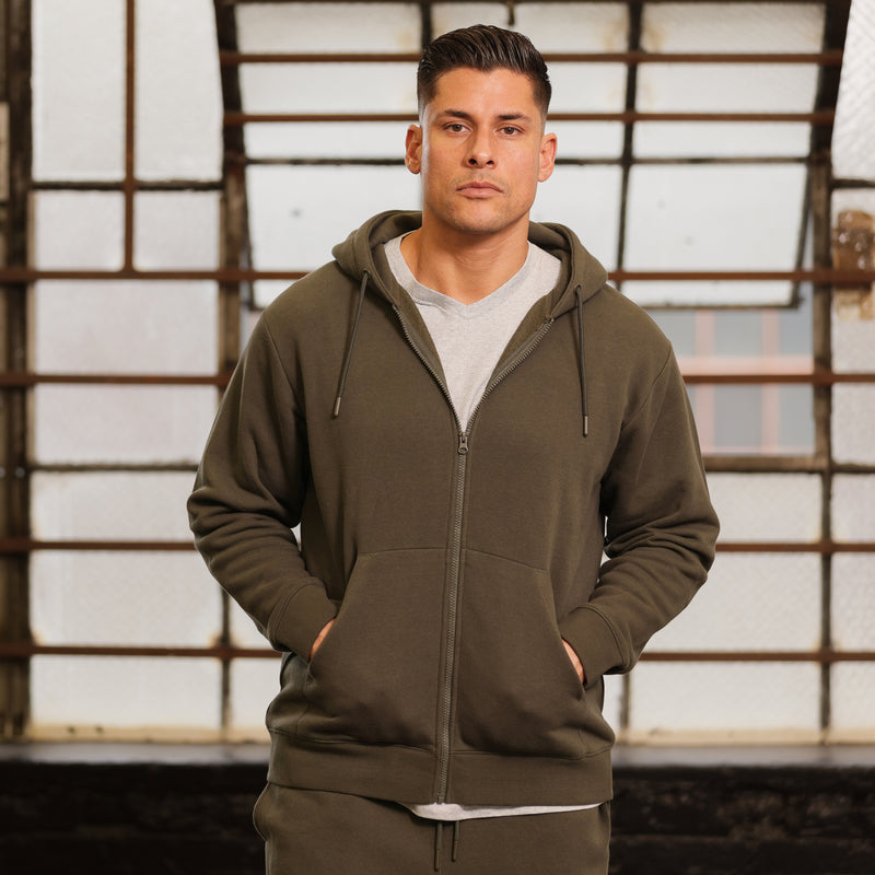 Men's olive fleece zip hoody on model, hood with drawstrings and kangaroo pocket