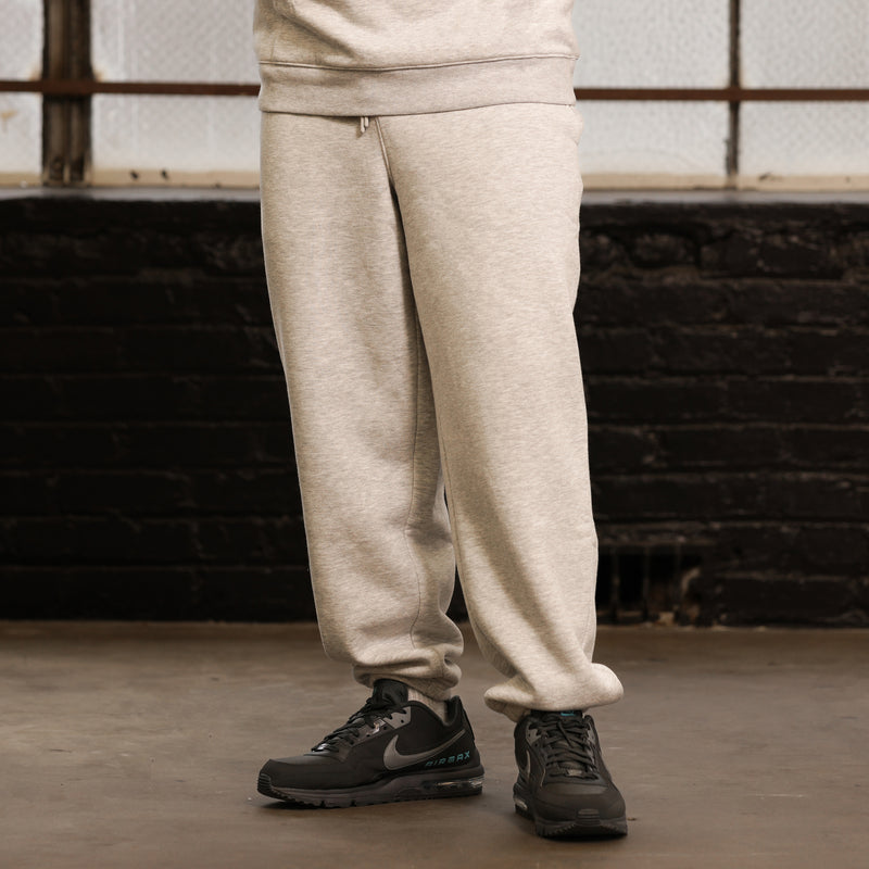 Heather grey fleece sweatpants with side pockets and cuffed hems