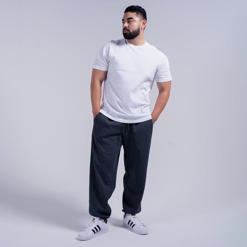 Men's charcoal fleece sweatpants with elastic waistband and cuffed leg openings