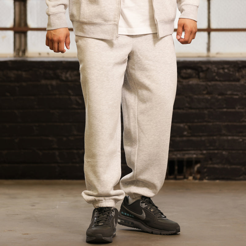 Heather grey fleece sweatpants with front pockets and cuffed ankle hem