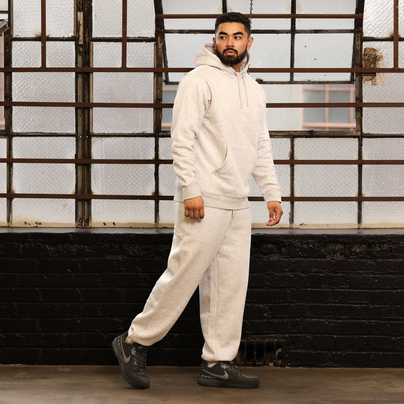 Heather grey fleece sweatpants with drawstring waistband and cuffed hems