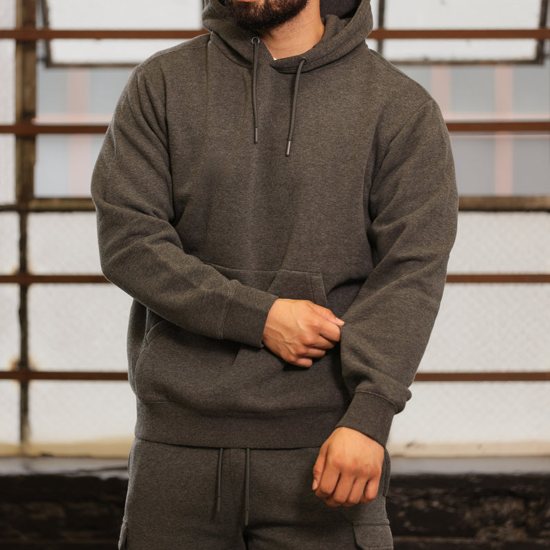 Men's charcoal fleece hoodie worn; hood with drawstrings and kangaroo pocket in front.
