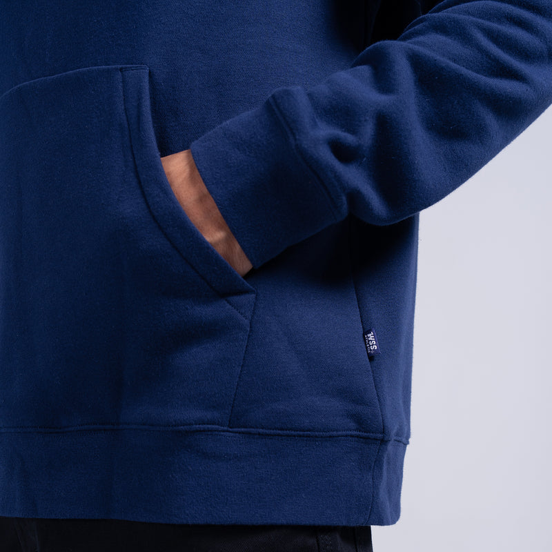 Navy fleece hoodie sleeve and kangaroo pocket detail with small logo patch