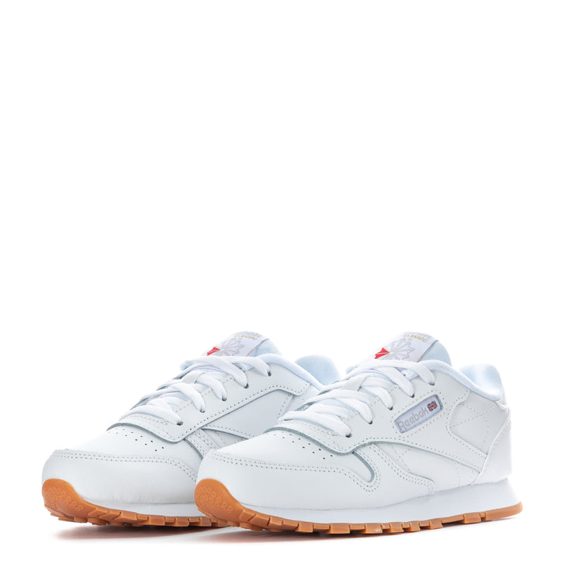 Kids white Reebok leather sneakers with gum tread and lace-up design