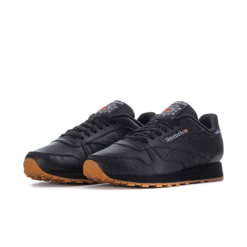 Pair of men's Reebok leather sneakers, black uppers and gum tread