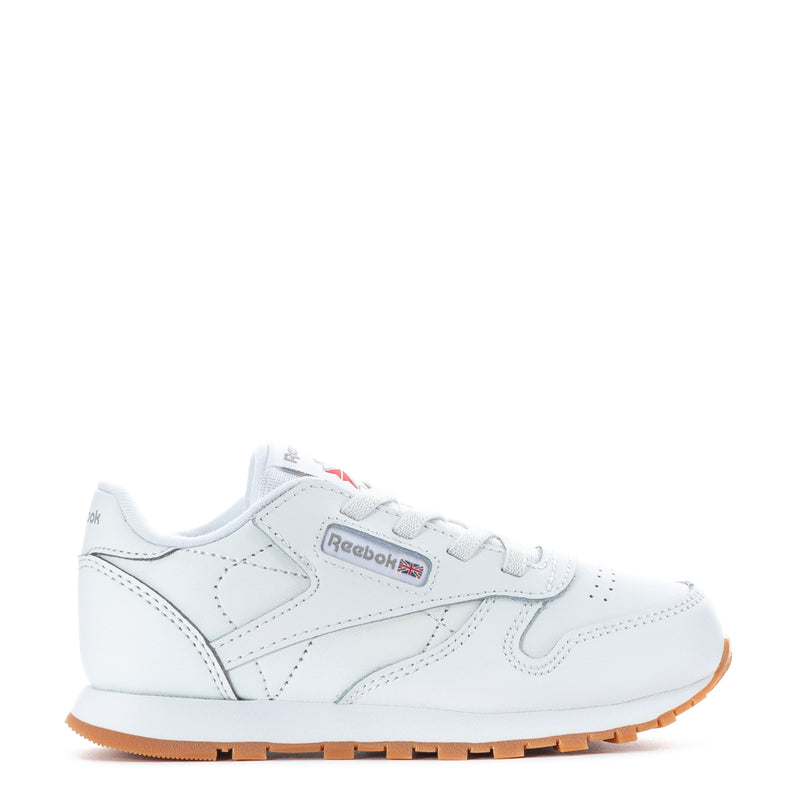 Toddler white leather sneakers with gum outsole, lace-up with Reebok logo.