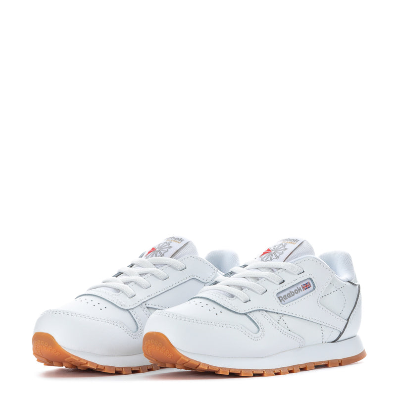 Toddler white leather sneakers, two shoes front view with gum tread sole.