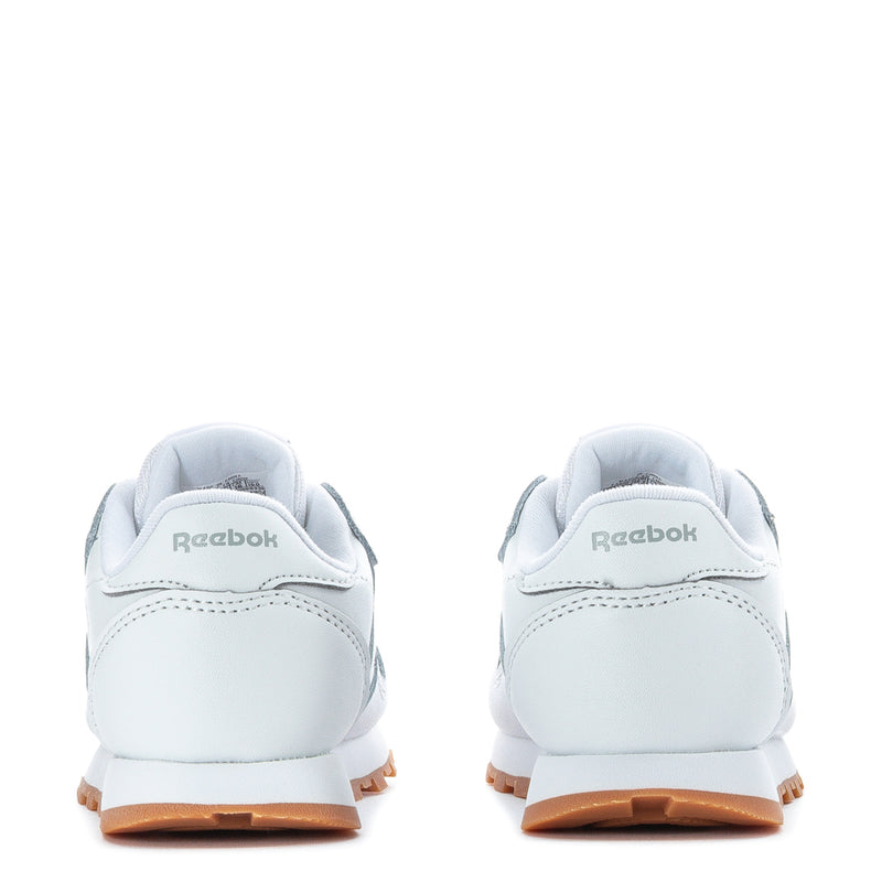 Toddler white leather sneakers, heel with lace loops and gum outsole.
