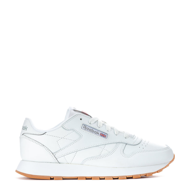 White leather youth sneaker with Reebok logo, white laces, gum rubber outsole