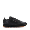 Youth black leather sneaker with Reebok side logo and gum rubber outsole
