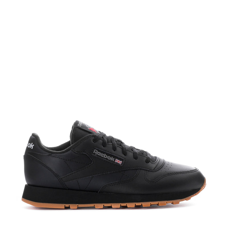 Youth black leather sneaker with Reebok side logo and gum rubber outsole