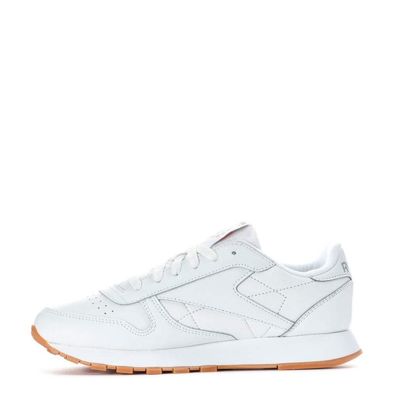 White leather youth sneaker side view with lace-up and gum rubber outsole