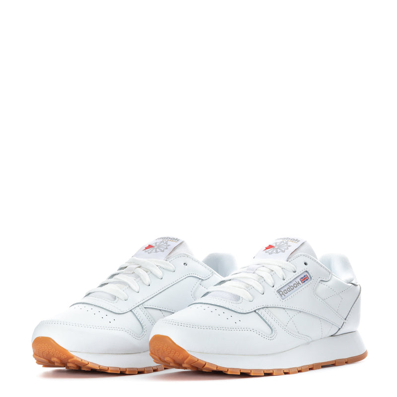 White leather youth sneakers, pair shown with lace-up and gum rubber outsole