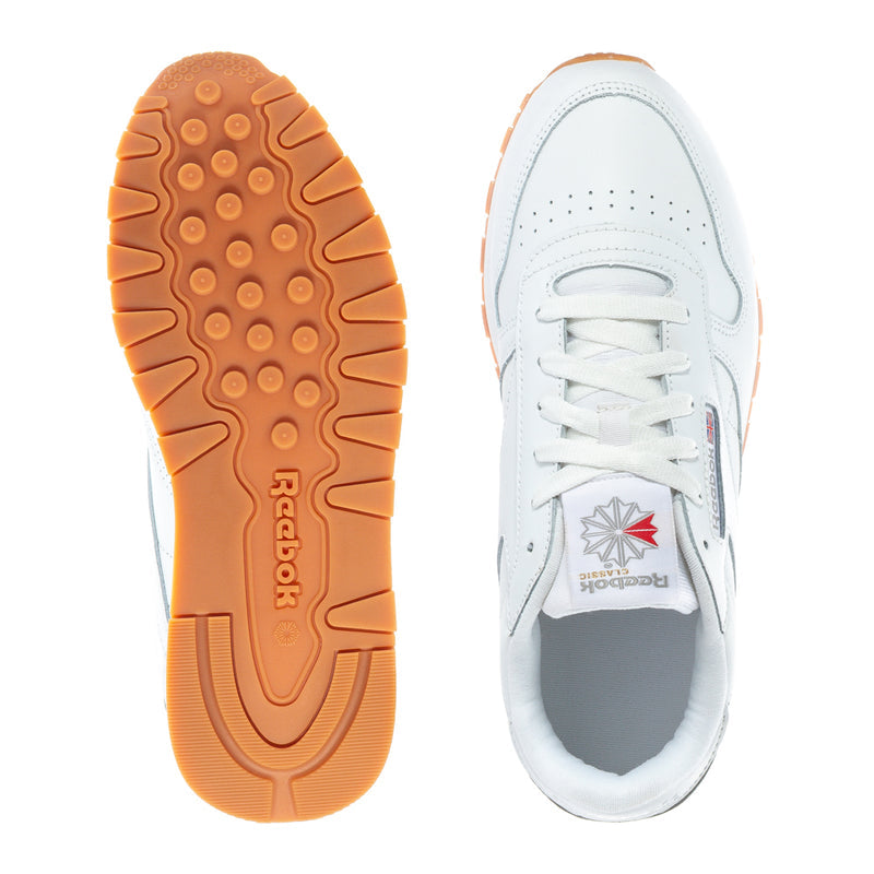 White leather youth sneaker outsole and heel, gum rubber tread underneath