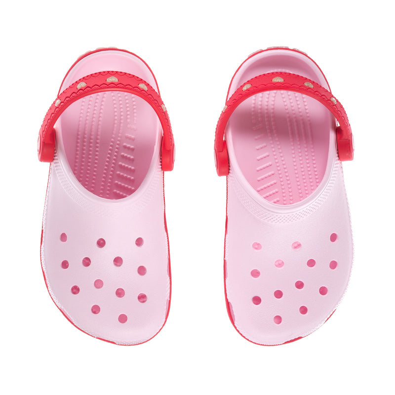 Kids white clog with pink interior, heart perforation dots, and top side strap