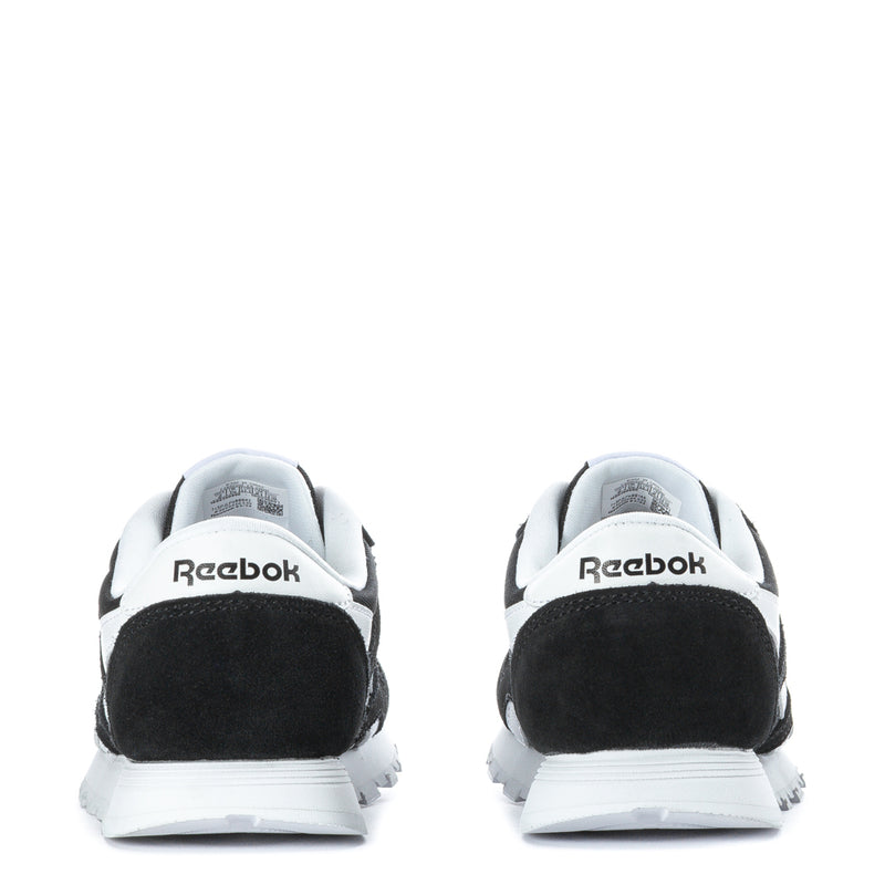 Kids' black-and-white sneakers back view, cushioned heel with Reebok branding
