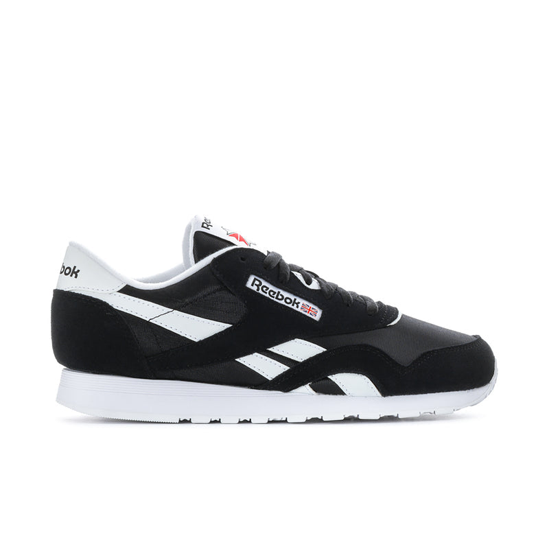 Men's black and white low-top Reebok sneakers, lace-up with side stripes