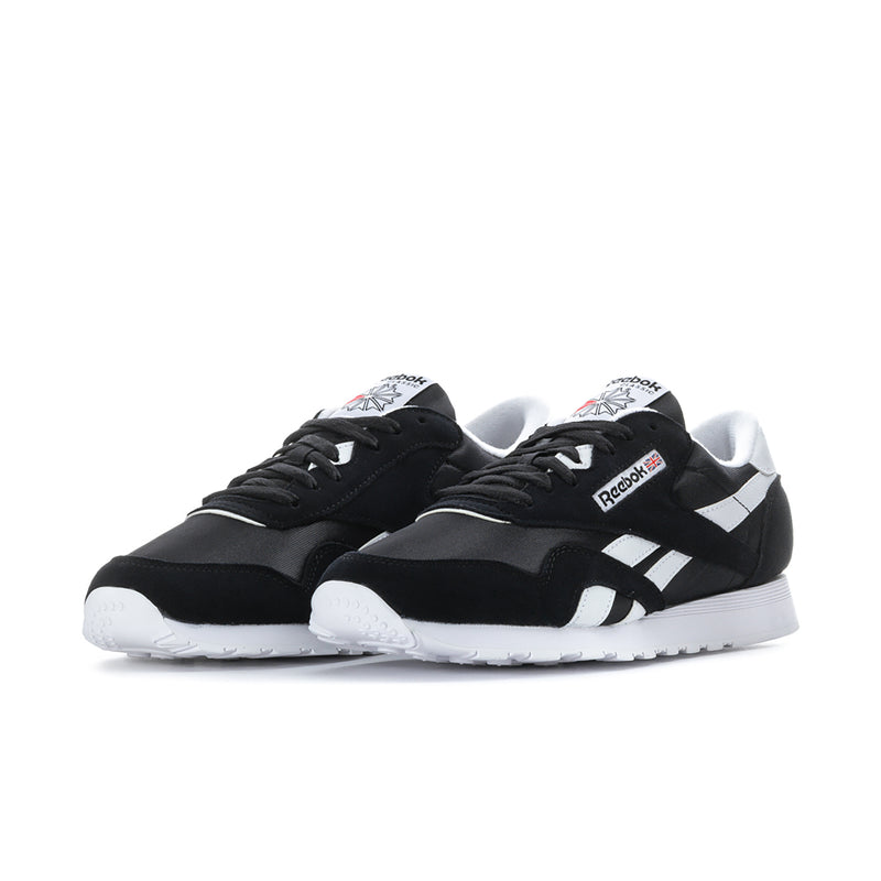 Men's black low-top Reebok sneakers, lace-up with white side panels
